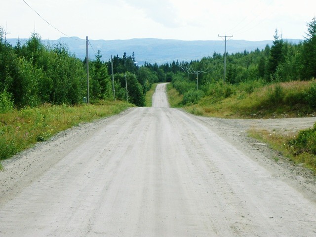 Part of a 20 km length of bumpy unsurfaced road.