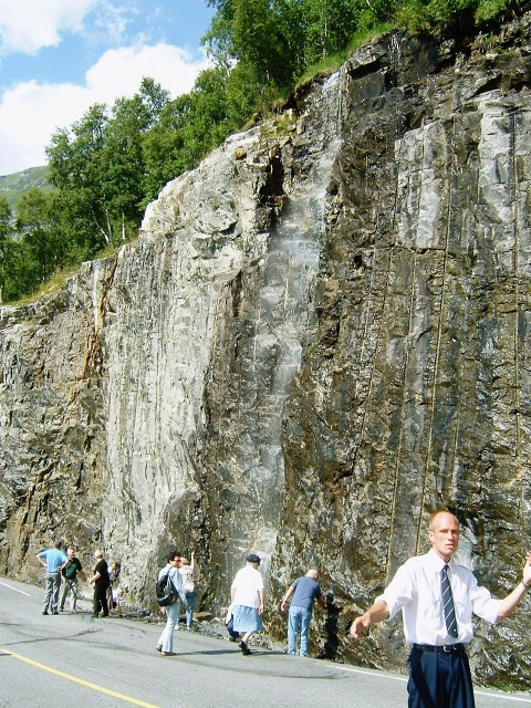A waterfall by the road.