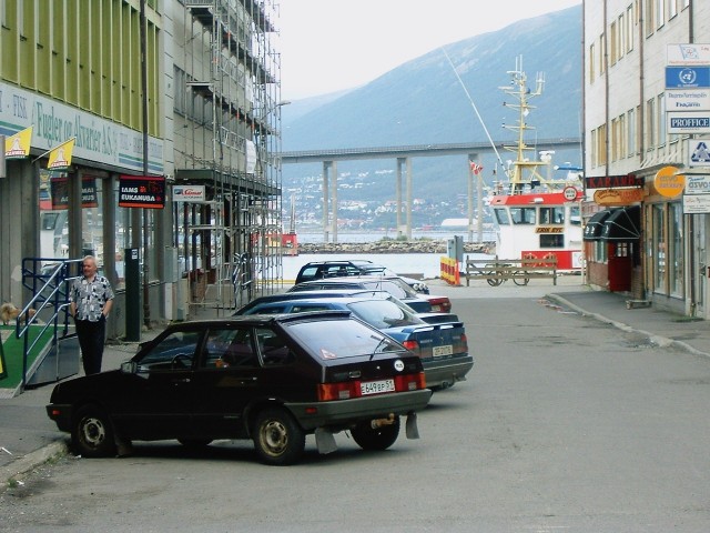 A Russian car in Troms harbour. Part of the bridge is visible beyond the end of the road.
