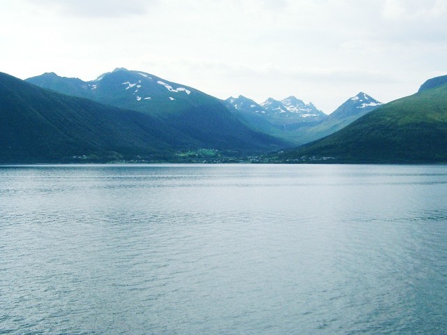 Snow-topped mountains seen from the coastal voyage.