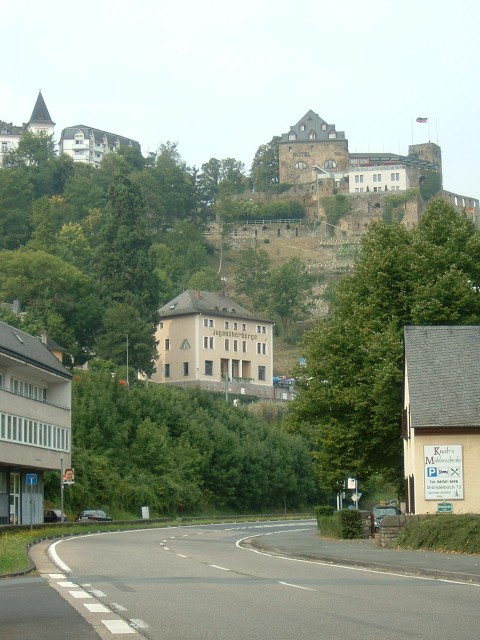 The town of Sankt Goar, featuring a bicycle-friendly hotel in the foreground, a Youth Hostel in the ...