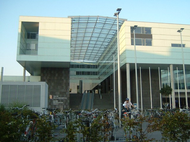 A building outside the station, and a load of bikes.