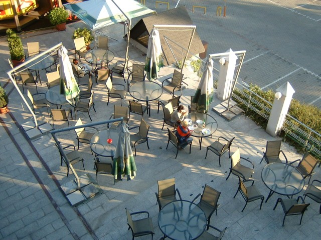 The outdoor part of the hotel's own restaurant. It doesn't really interest me though; I know where I...