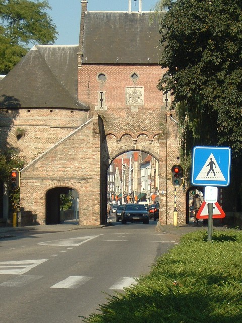 An entrance to the old part of Bruges. The city walls seem to be completely intact so all roads in a...
