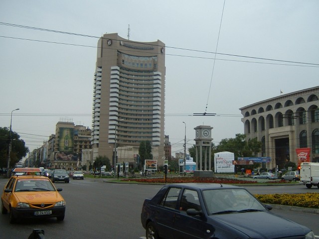 University Square, dominated by the Intercontinental Hotel. Under the clock in the middle is a displ...