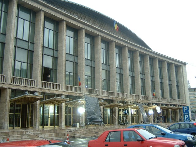 I don't really know what this building is but there's some kind of filming going on outside it.