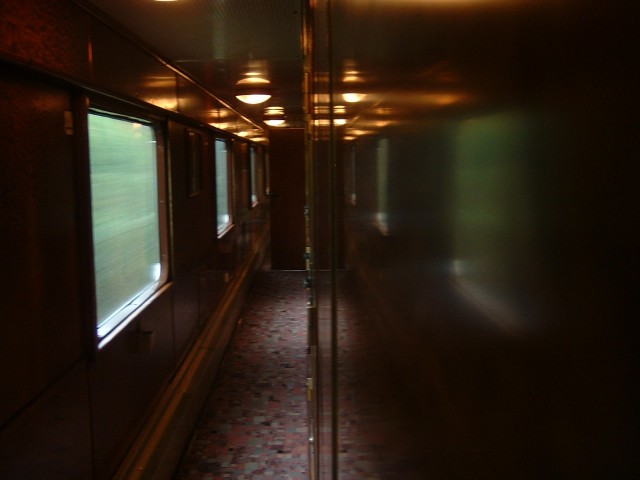 The train's corridor. The attendant has now converted my seats into a bed and is patrolling the corr...