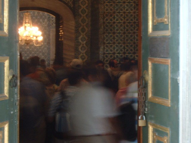 Tourists looking at bits of Mohammed in the Sacred Safekeeping Rooms. We're not allowed to take phot...