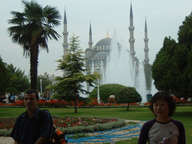 The Blue Mosque, seen from across Sultanahmet Park. I took another photograph without the woman but ...