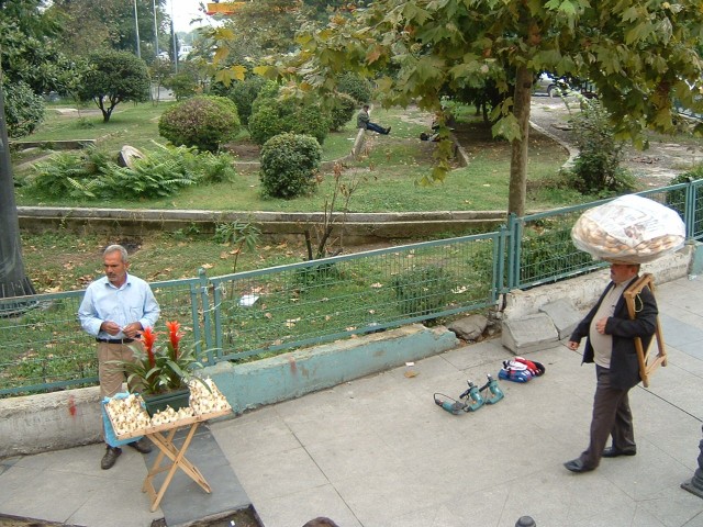 Street vendors. "Flowers, lovely flowers?" "Bread?" "You want cordless dril...