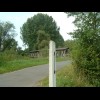 A covered bridge on the Rhein cycleway. The number 2 in the foreground is one the the markers which ...