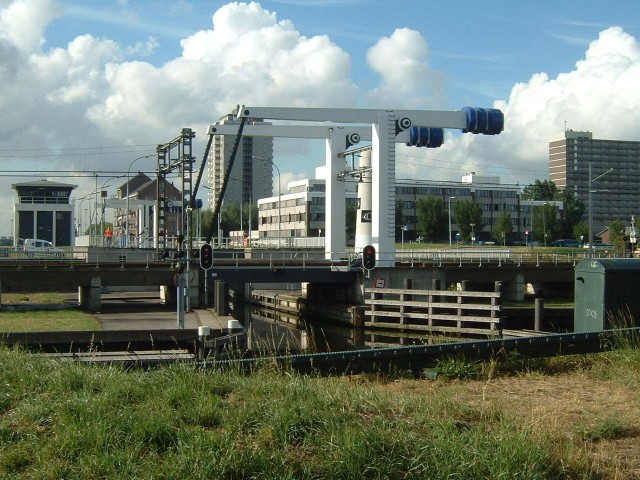 A lifting railway bridge over a canal. It looks like the trains don't get any power while they are o...