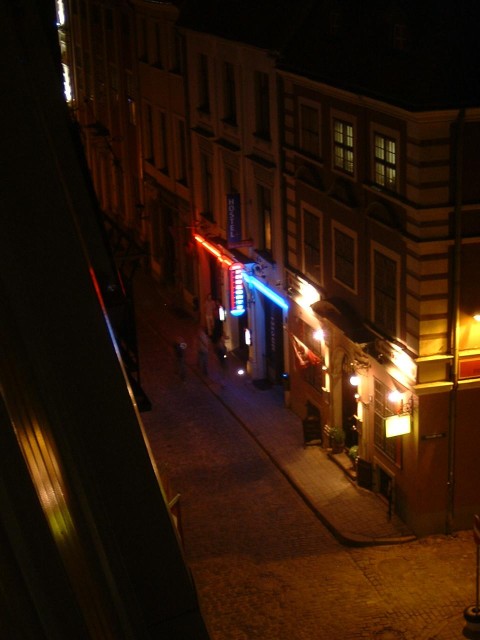 The view from my balcony again, this time in the dark. That place with the red and blue lights is li...