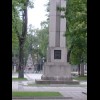 The Statue of Freedom in Kaunas, with an eternal flame in the background.