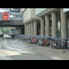 Bikes outside the station in Utrecht. They fill the area behind the columns too and continue like th...
