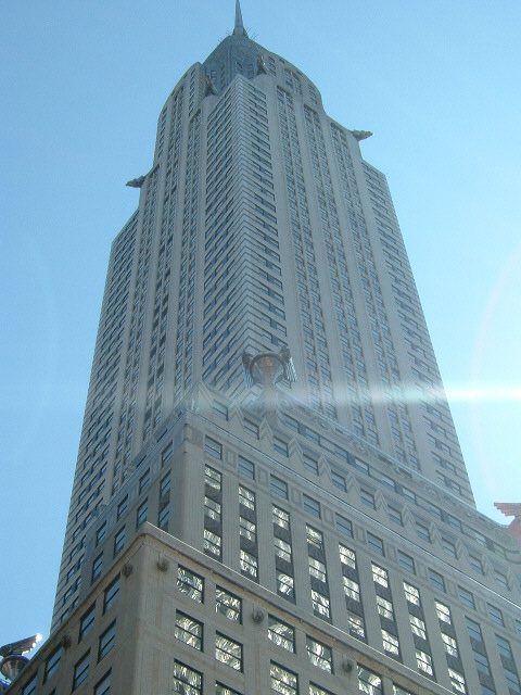 Here's the other. You saw its spire glowing in the early morning gloom. Now here it is by day. The C...