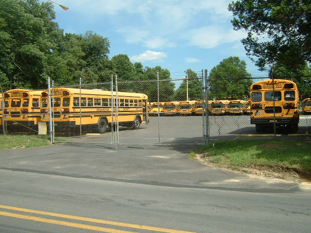 Part of a large yard full of school buses. I think the schools are on holiday now. What I've never r...