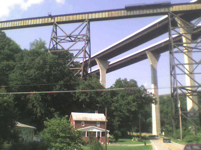 The railway and the Pennsylvania Turnpike both soaring high above me. The railway bridge looks typic...