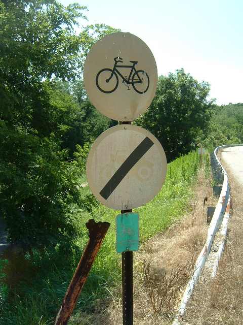 Here's a good one. A sign used to denote a cycle route: 'no cycling'!
