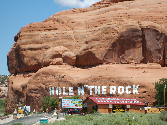 'Hole n The Rock'. I'm not quite sure about the punctuation on the big sign. It's a 14 room house ca...