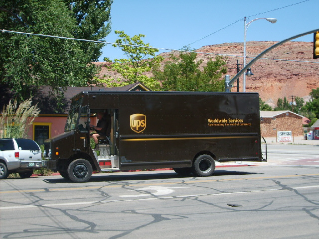 Here's the UPS man heading towards the bike shop. I wonder if he's got my wheel.