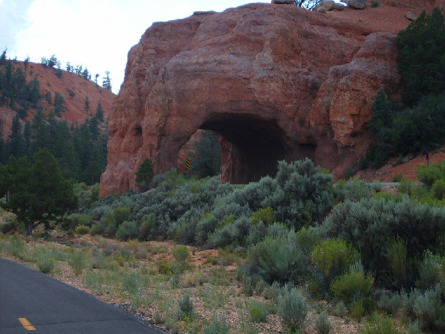 That's not a natural arch; it's a tunnel for the road.