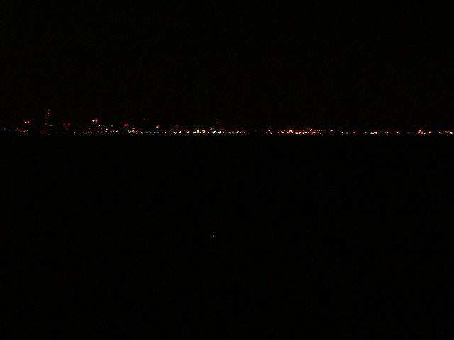 The approaching New York skyline. The red dot on the left which is higher than any of the others is ...