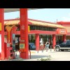 Look at this petrol station. Not only is there a burger bar in the shop but you seem to be able to o...