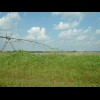 Here's one of many giant irrigating machines which cover the prairie. Somewhere in the distance is t...
