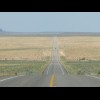 On Google Earth, this road is visible from an altitude of about 90 km as a black line cutting across...