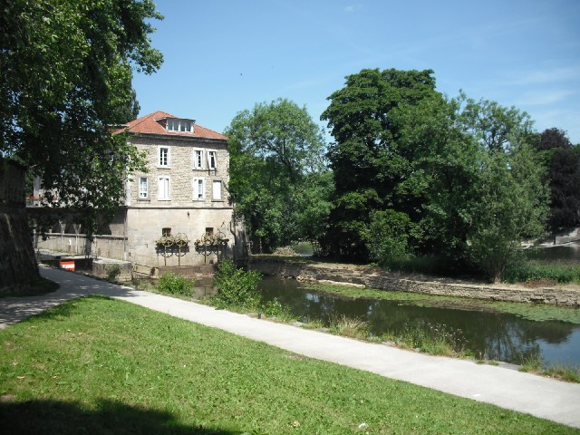 By the river.