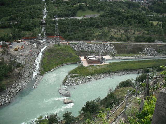 Part of the river Dora emerging from a hydroelectric facility.
