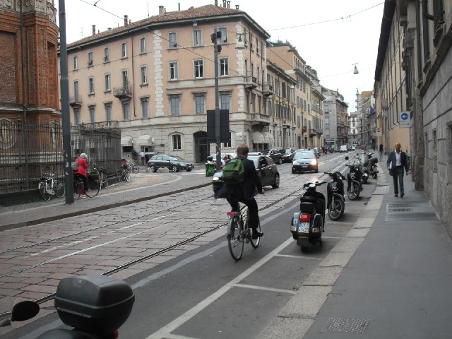Bikes and mopeds are popular here. I like the little parking spaces.