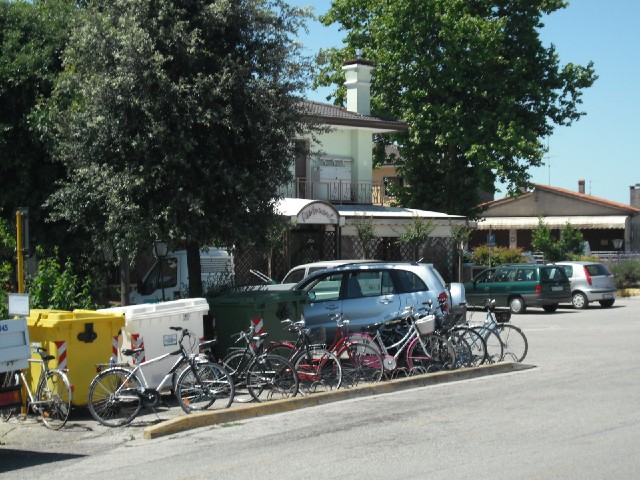 Bikes outside a restaurant in a small town.