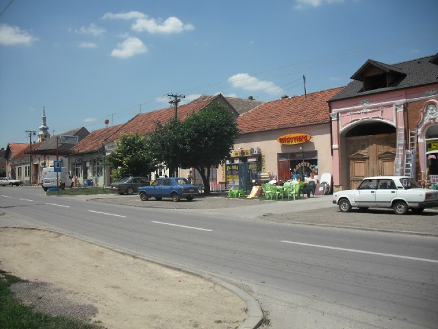 Shops in Beska. Each one has a bead curtain in the doorway with coloured beads forming a single word...