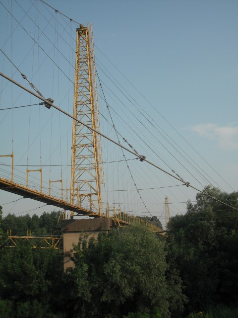 A suspension bridge for pipes. There are several oil and gas installations around here. One refinery...