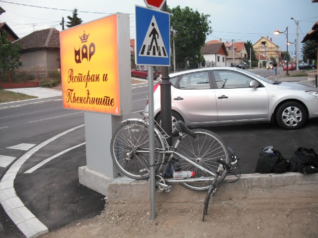 Here is the bike locked up outside the Hotel Car, although even in Cyrillic, I don't know what that ...