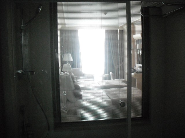 Not sure why this hotel has a window between the bedroom and the bathroom.