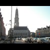 The Place des Hros in Arras. After the rain, it's turned into a sunny, cloudless evening. The forec...