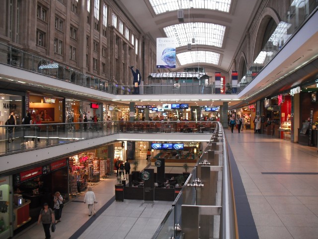 This whole shopping centre is inside the station. The ticket halls are behind the wall on the left. ...