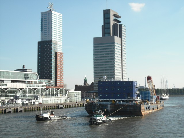 The bridge is open to let this barge through. From the writing on it, I think it's some kind of dril...