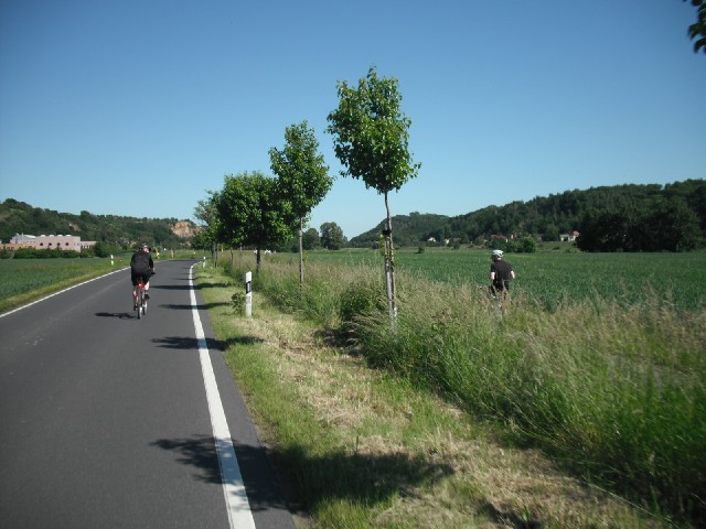 Here, the cycle path runs alongside the road. Those two cyclists are together but have made differen...