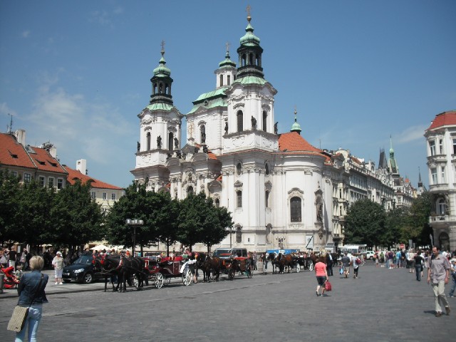 The Old Town Square, with some tourist carriages.
