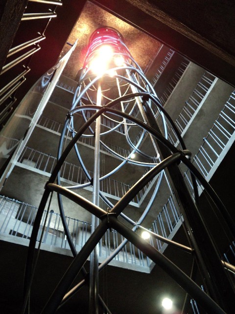 The lift and sloping walkway inside the tower of the City Hall. The bright lights are on the base of...