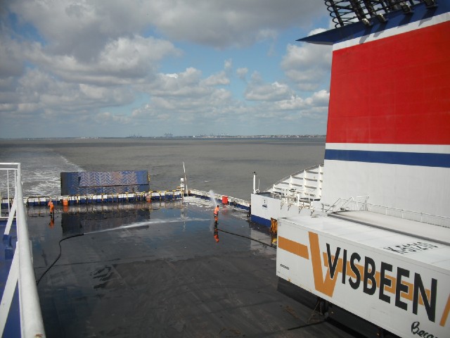 Some people cleaning the ferry.