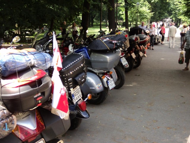 Here are some Polish flags on motorbikes. I just saw the bikers carrying some kind of wreath up to t...
