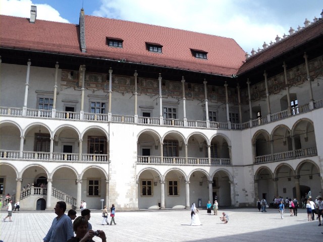 Inside the Castle, with another bride and groom being photographed in the sunlight.