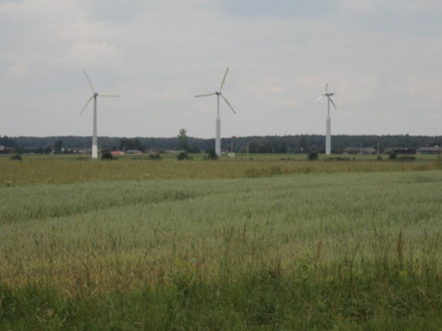 One of these wind turbines in the villabe of Baby seems to be missing half of one of its blades.<br>...