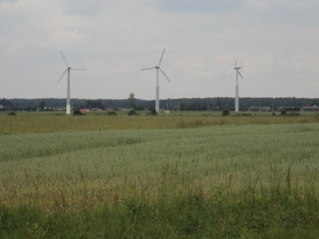 One of these wind turbines in the villabe of Baby seems to be missing half of one of its blades.<br>...