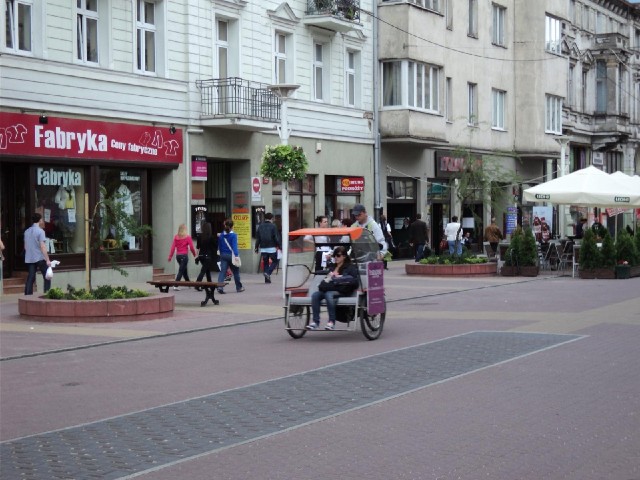 There are lots of these rickshaws zipping around. It looks to me like a rather scary ride, what with...